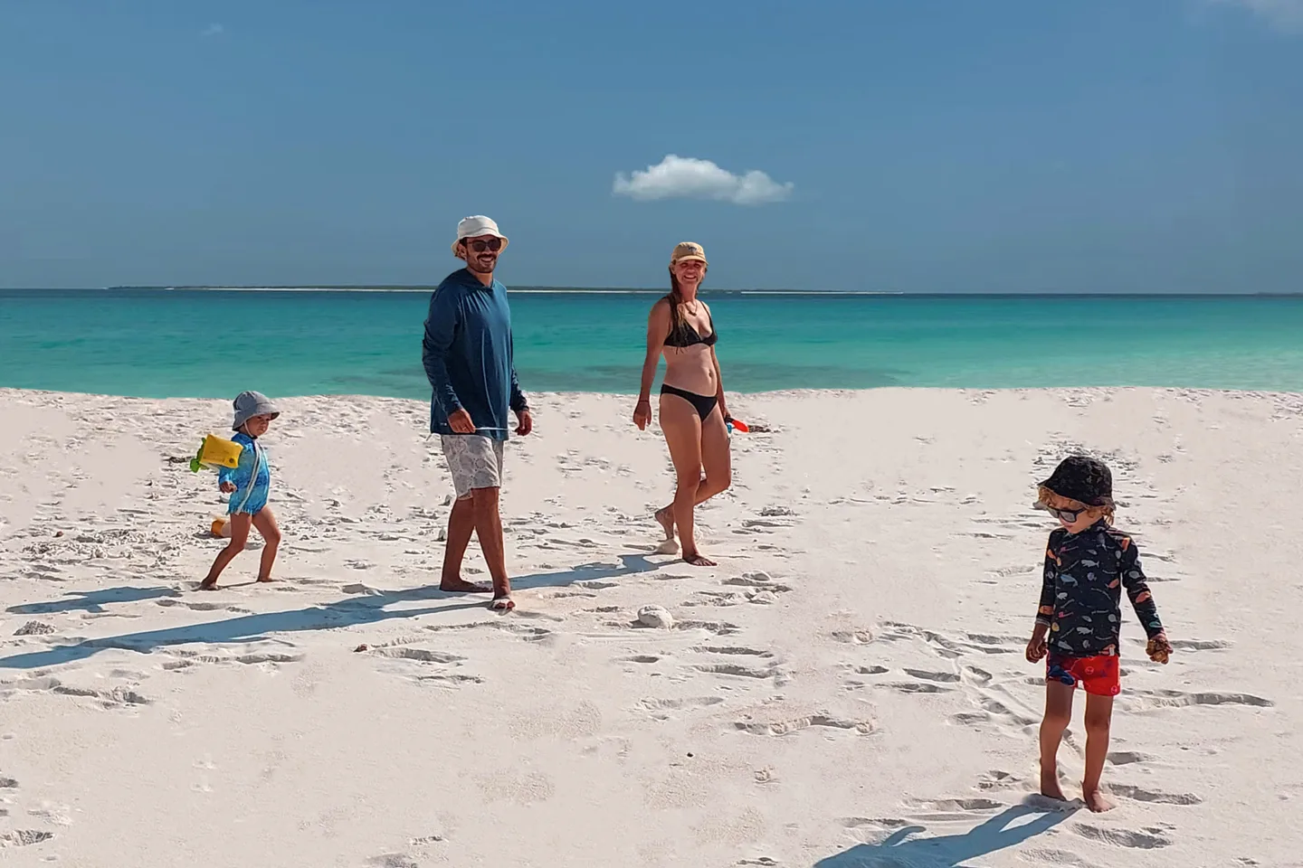 Maria Frisch and her family on a tropical beach